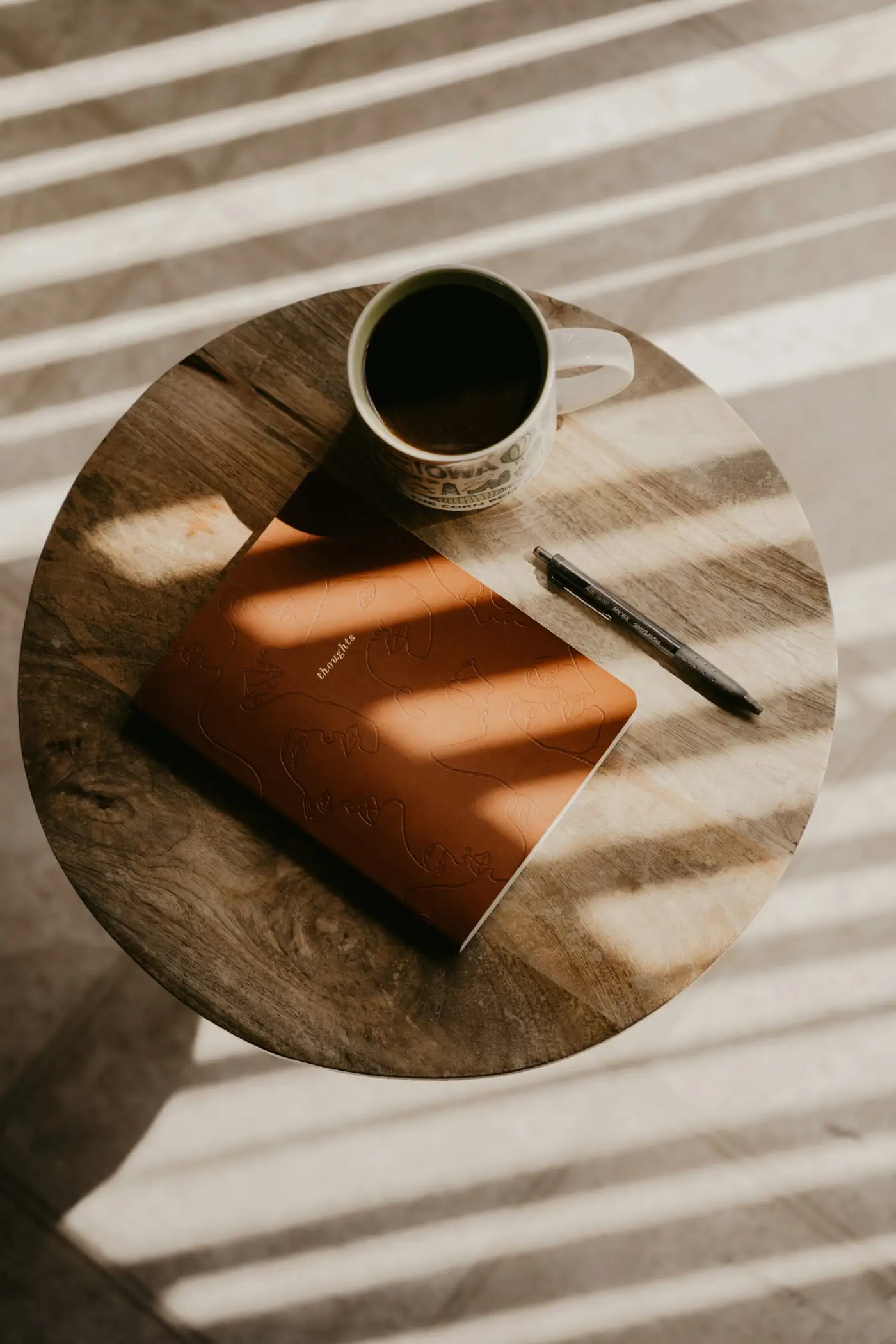 Desk with notebook and coffee